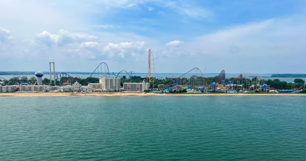 Aerial view of Cedar Point Amusement Park surrounded by Lake Erie on both sides.