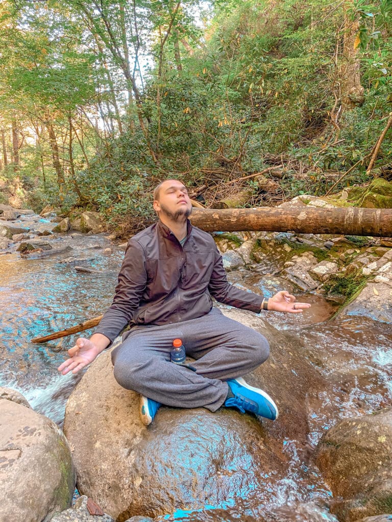 man meditating in nature