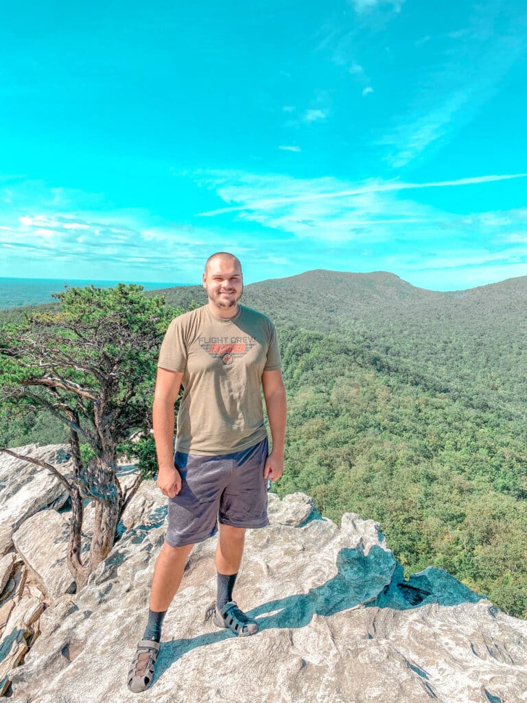 man standing on top of mountain North Carolina