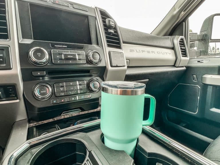 Travel Yeti coffee mug in cup holder inside truck