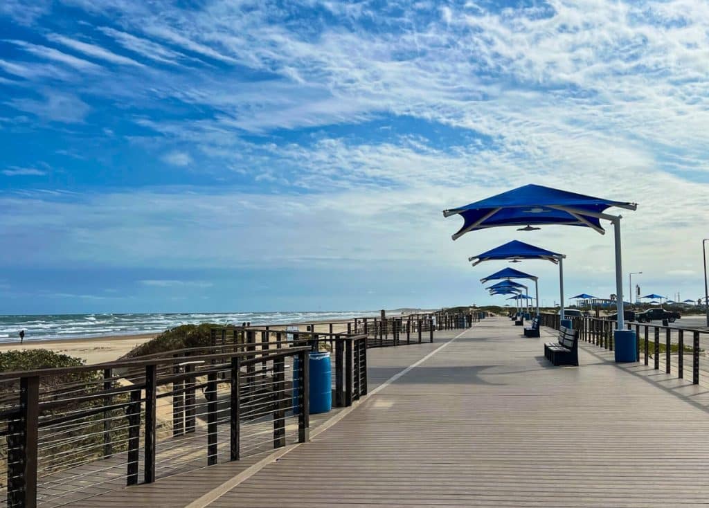 Beach boardwalk with shaded benches over looking the Gulf of Mexico in Isla Blanca RV Park