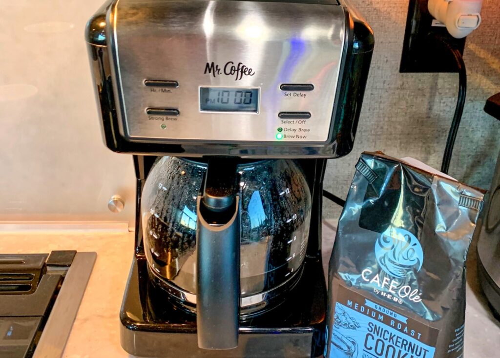 Mr. Coffee machine brewing coffee in an RV kitchen.