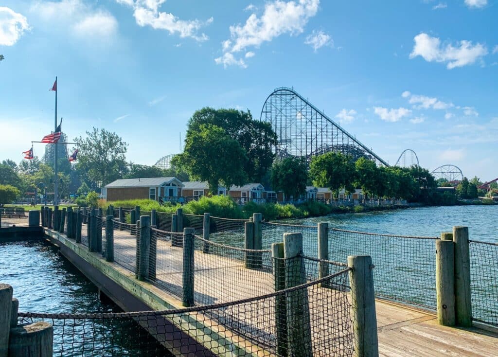 Pier overlooking the lake, cabins, and amusement park at Cedar Point's Campground.