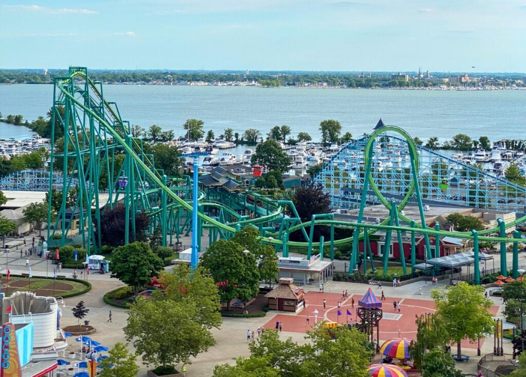 Raptor and Blue Streak roller coasters at Cedar Point in front of a marina filled with boats and the Sandusky Bay.