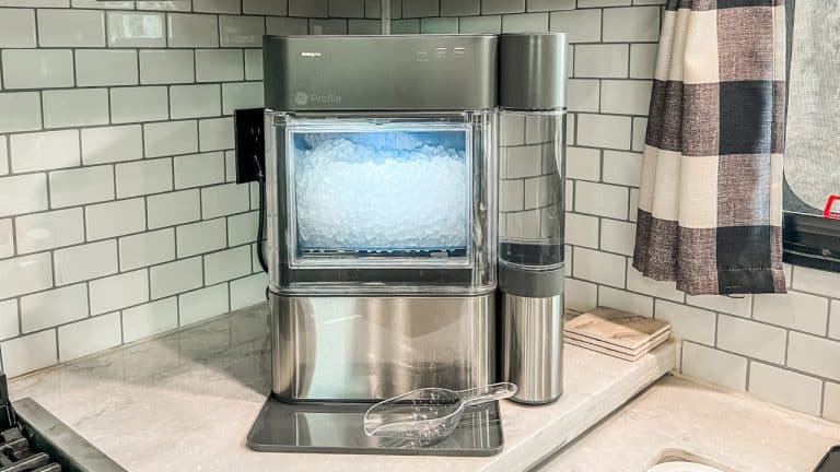 Opal nugget ice maker sitting on white counter top.