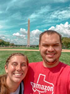 man and woman smiling in front of Washington monument