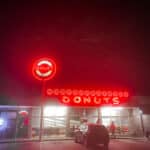 Gibson's Donuts Shop lit up at night