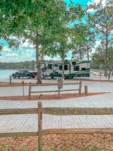 RV and truck with lake in background
