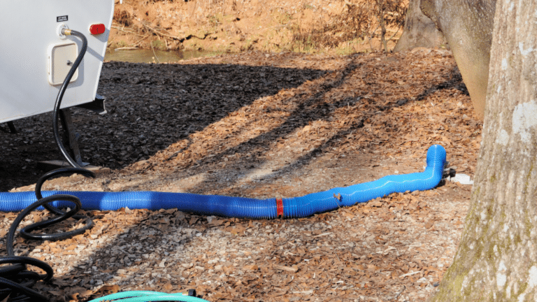 RV Hookups - Sewer hose, electric plug, and water hoses.