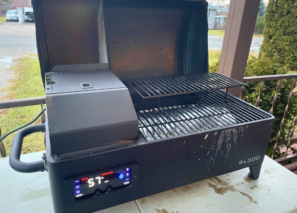 Louisiana Grills SL300 on table with lid open