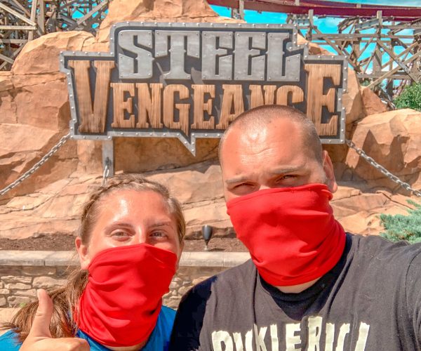 couple in front of steel vengeance roller coaster